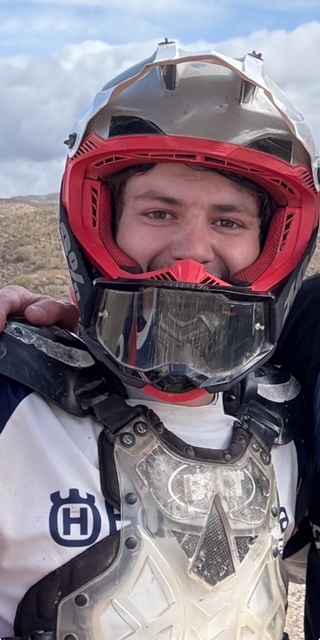 Photo of Nate smiling in motocross gear