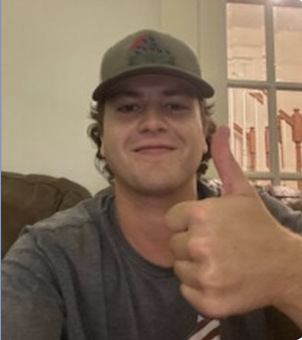 Nate smiling with thumbs up