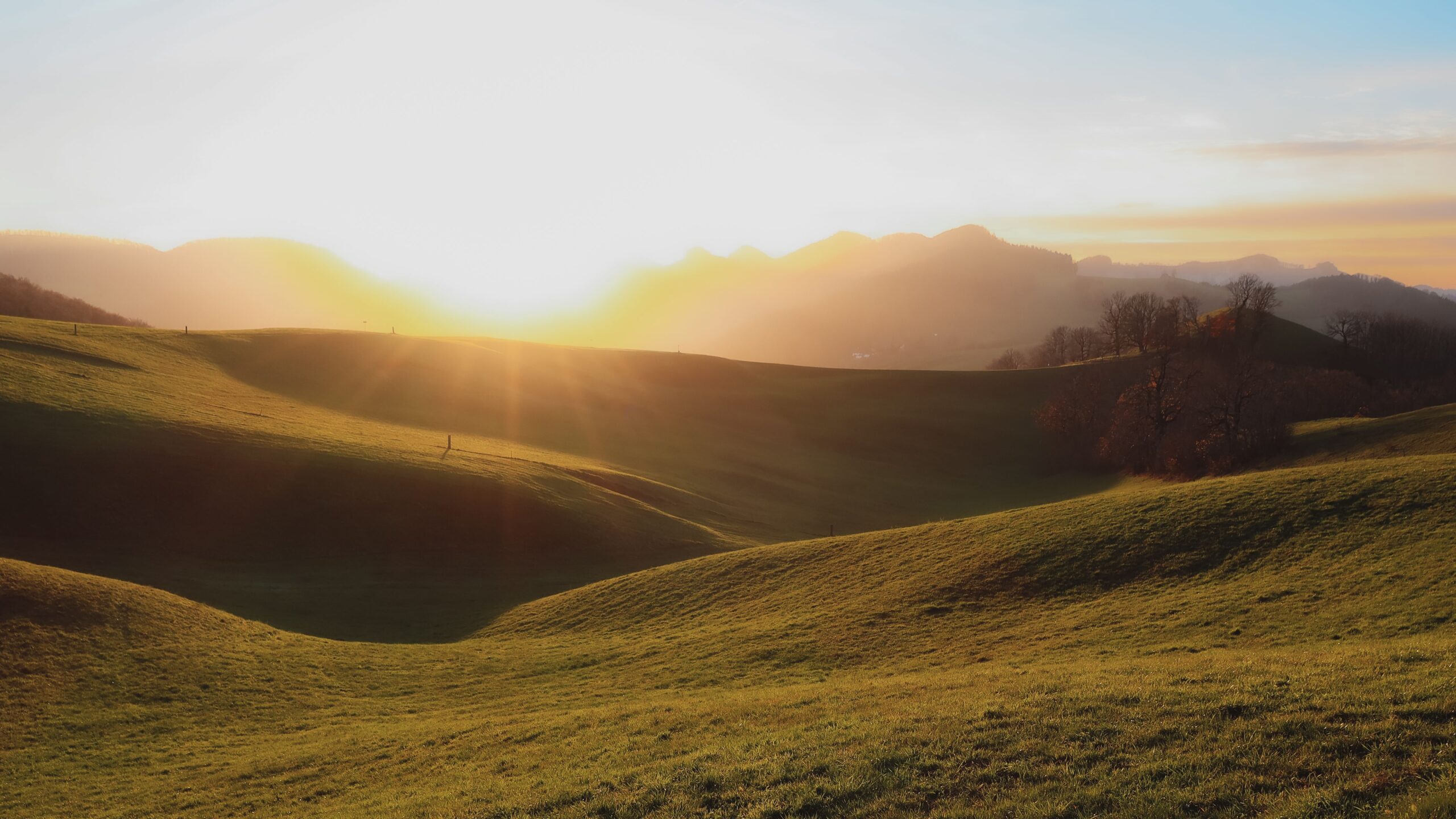 Sunrise over rolling hills